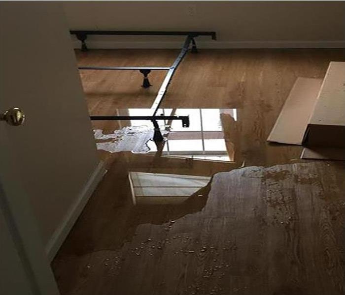 water covering wood flooring